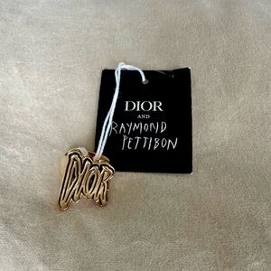 Dior Gold ring by Raymond Pettibon